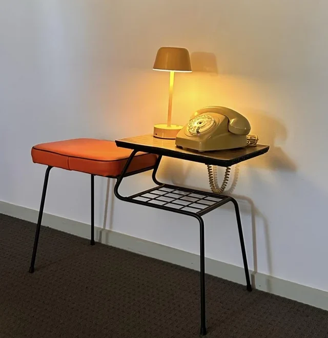 orange phone on small table